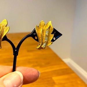 Vintage rhinestone earrings.  Leaf pattern with quality rhinestones.  Clip-on